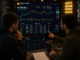 Traders analyzing Bitcoin at $81k.